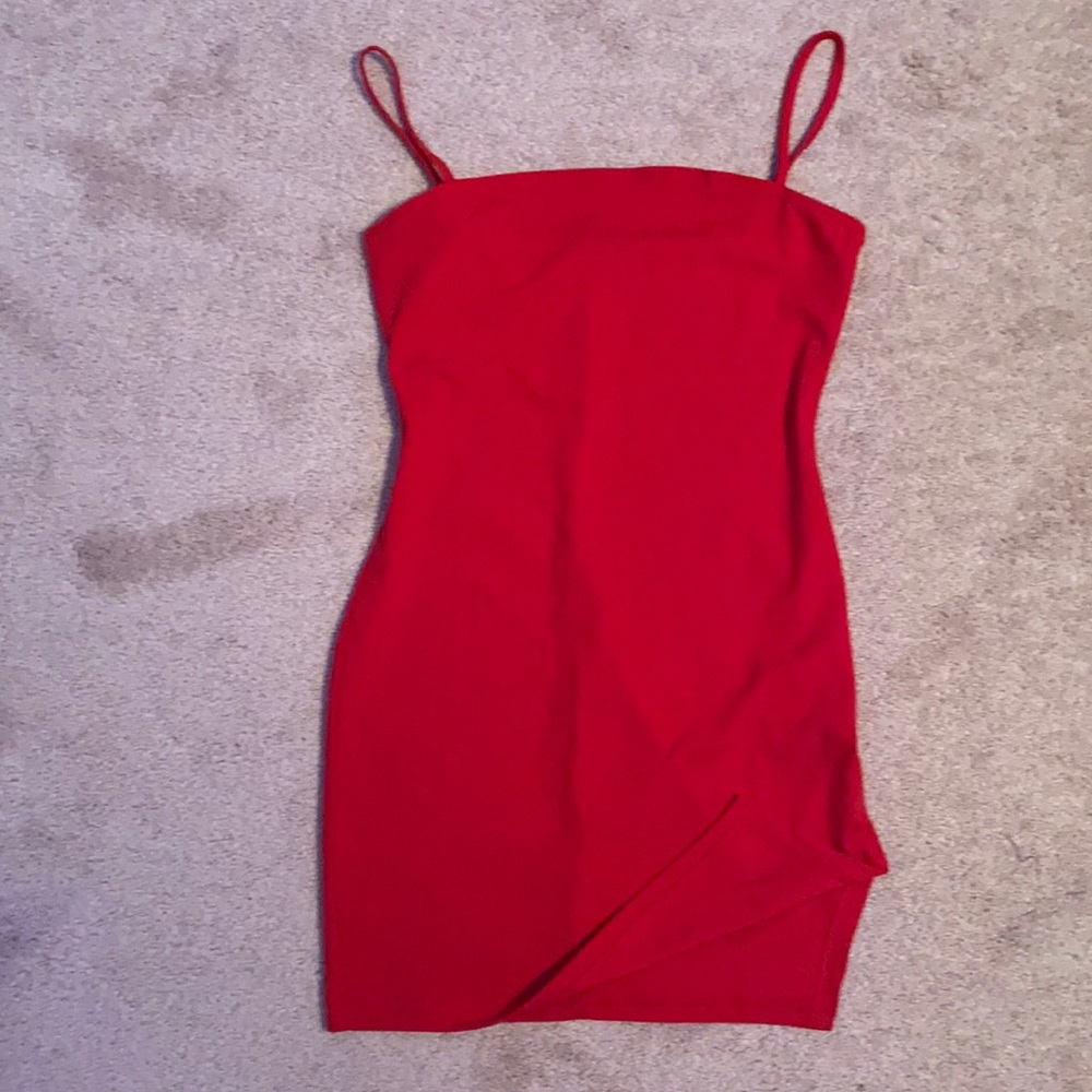 Red body con mini dress with a slit.